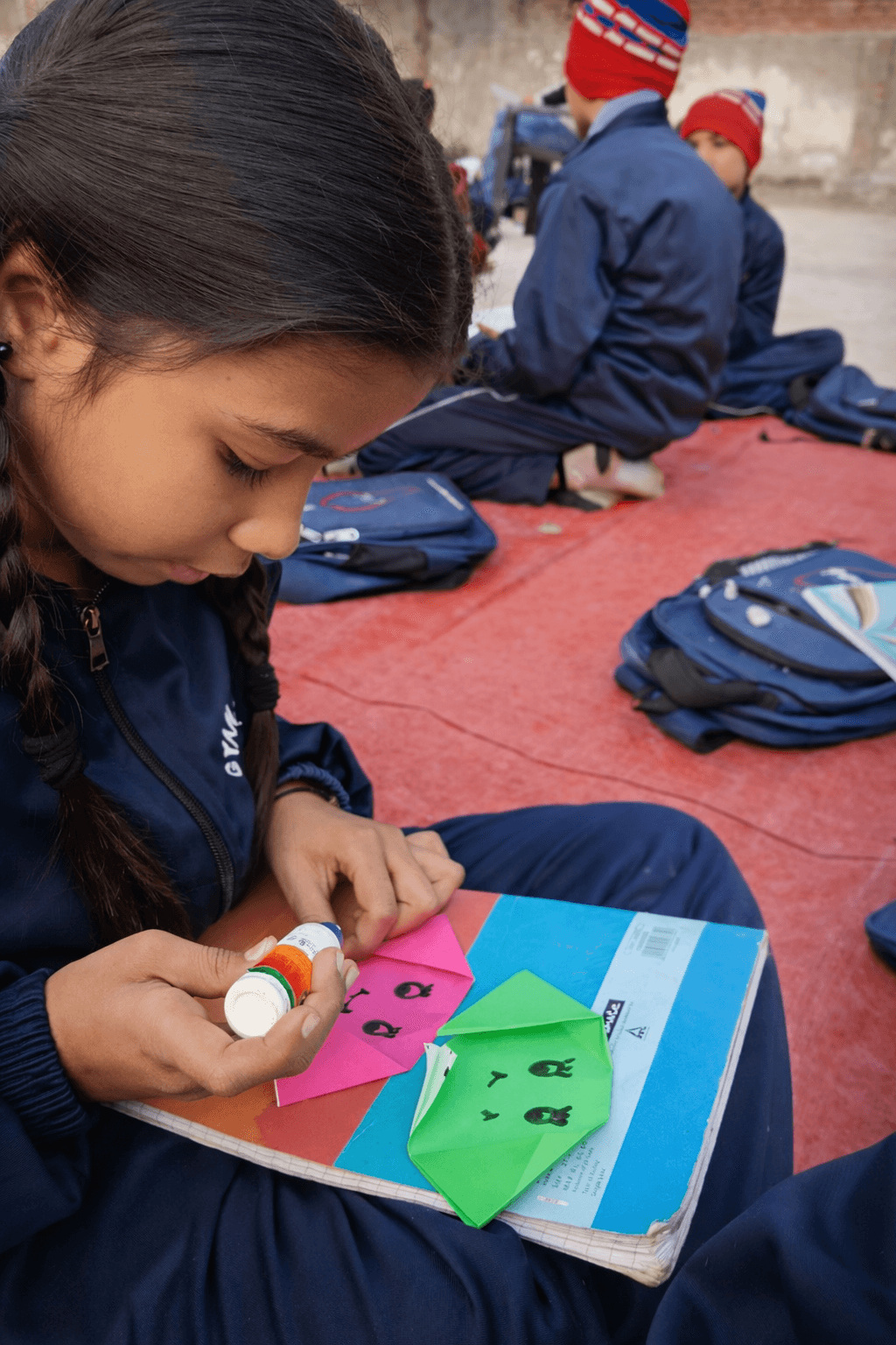 Student engaged in origami craft